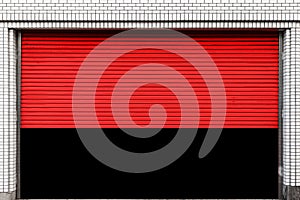 Red roller shutter doors on the ground floor of the house