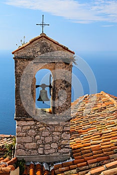 Red roof chapel cross with Mediterranean sea view at the French