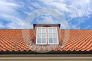 Red roof with a dormer