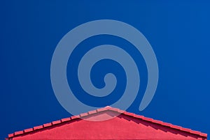 Red Roof Gable and Blue Sky