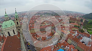 Red roofed streets of Prague, European city aerial, fly over