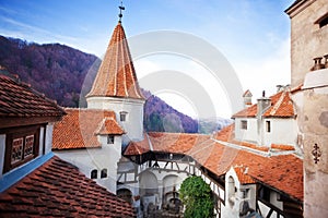 Red roofs of Bran Castle in inner yard, Romania