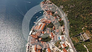 Red roofs of old houses on the coast of Perast. Bay of Kotor, Montenegro