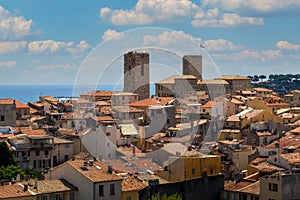 Red roofs, old houses and medieval towers in Antibes, France