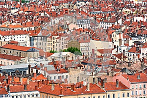 Red roofs and stone chimneys in the city of Lyon