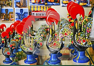 Red rooster paperweights souvenirs handicrafts Lisbon Portugal photo
