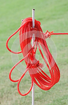 The red rope on iron prong pole.