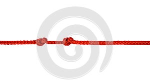 Red rope with knot isolated on white.