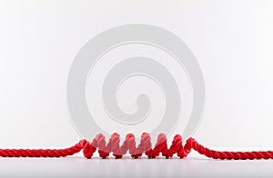 Red rope with a spiral Isolated on white background