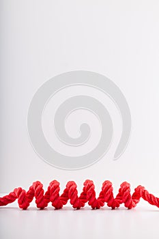 Red rope with a spiral Isolated on white background