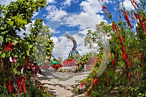 Red rope on tree and Statue of Naka Buddha at Mukdahan Province,Big Buddha Wat Phu Manorom Mukdahan Thailand