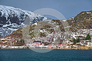 Red rorbu houses in Norway in winter