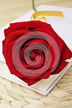 Red rose and book, for Saint Georges Day in Catalonia, Spain