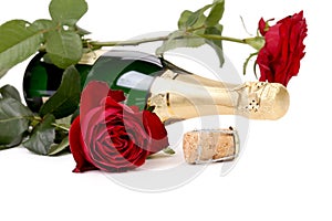 Red rose and a bottle of champagne.