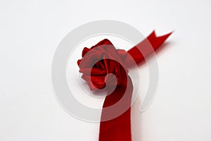 Red rose made from a satin ribbon