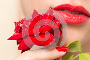 Red rose, red manicure and red lips