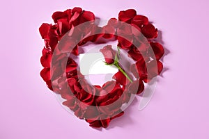 Red rose petals in heart shape