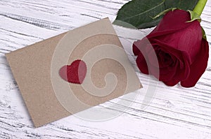 Red rose and a red heart envelope for valentine