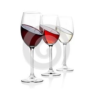 Red, rose and white wine in glass, isolated