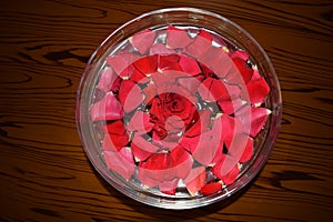 Red Rosepetals In Water filled Bowl