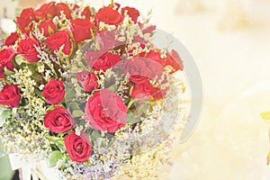 Red roses bouquet with glowing light background