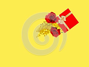 Red roses and  box for gift with  gold bow flowers  branch mimosa on  yellow background template for greetings card Women day , Va