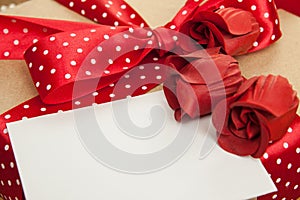 Red roses, card and gift box. Valentine background, greeting car
