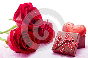 Red roses and chocolate heart shape presents