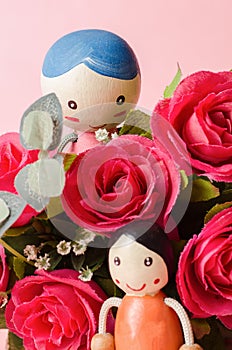 Red roses and couple doll