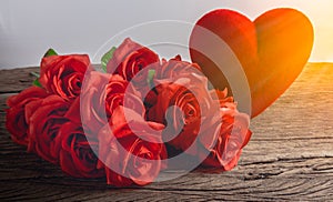 Red Roses with hearts on old wooden board, Valentines Day