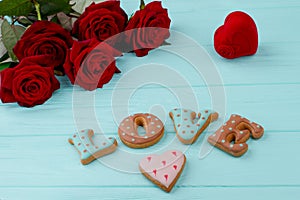 Red roses and letter cookies.