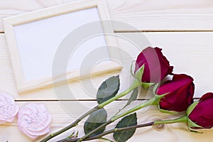 Red roses, marshmellows and photo frame