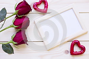 Red roses and photo frame