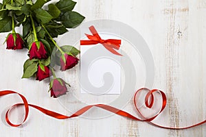 Red roses and ribbons in the shape of heart