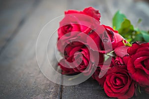 Red roses on wood background,Retro vintage