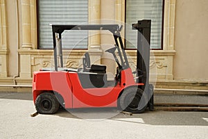 Red Rough Terrain Forklift in the yard
