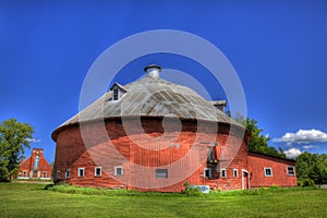 Red Round Barn with Church