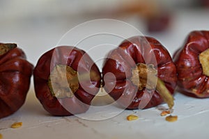 Hot and spicy Red round chillies on the abstract background