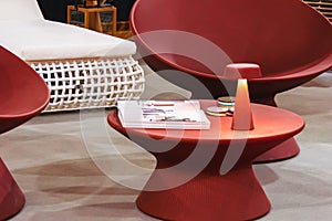 Red round plastic table with lamp