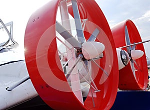 Red round propeller airplane closeup detail