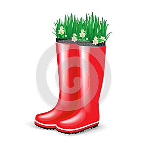 Red rubber boots with grass and flowers