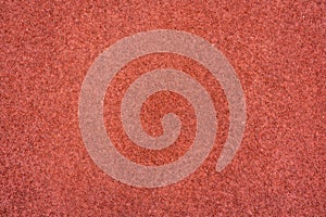 Red rubber running track texture background.