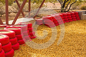 Red Rubber Tires Used As Bumpers For Small Children at Desert Pl