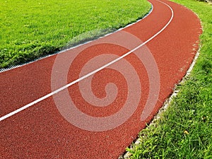 Red running racetrack on the stadium. Red running tracks in the stadium. Empty sport stadium.