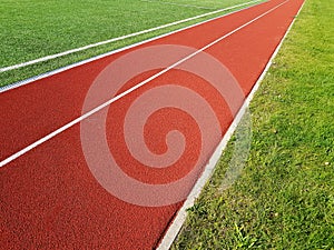 Red running racetrack on the stadium. Red running tracks in the stadium. Empty sport stadium.