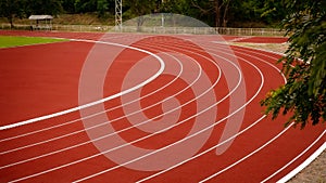 Red running track in public stadium. Sport Backgrounds