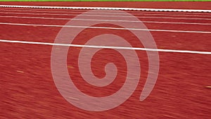 Red running track in public stadium. Sport Backgrounds. The view while running.