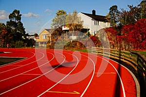 Red running track and sports stadium, Norway