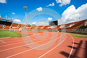 Red running track start point in athletic stadium from bangkok