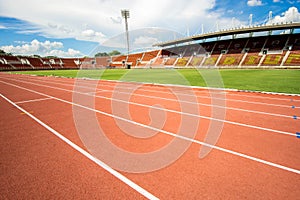 Red running track start point in athletic stadium from bangkok